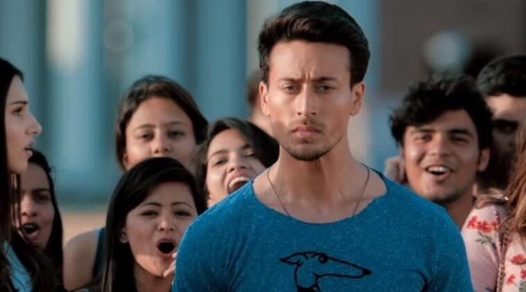 Tiger Shroff from Student of the Year 2 walking while being surrounded by other students