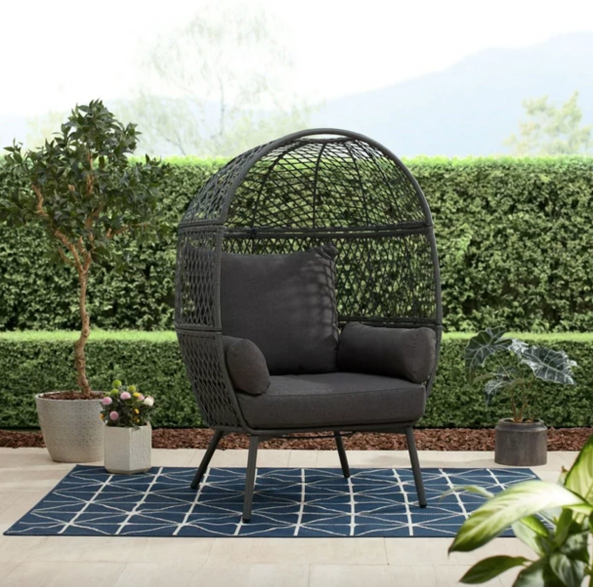 Charcoal gray egg chair on patio