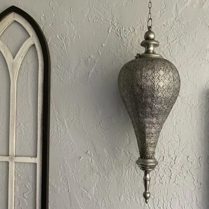 a reviewer photo of the silver hanging metal lantern