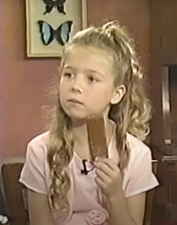 young jenette eating a popsicle