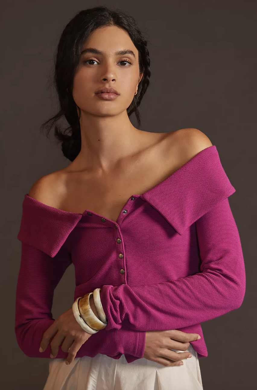 model wearing off the shoulder top in purple