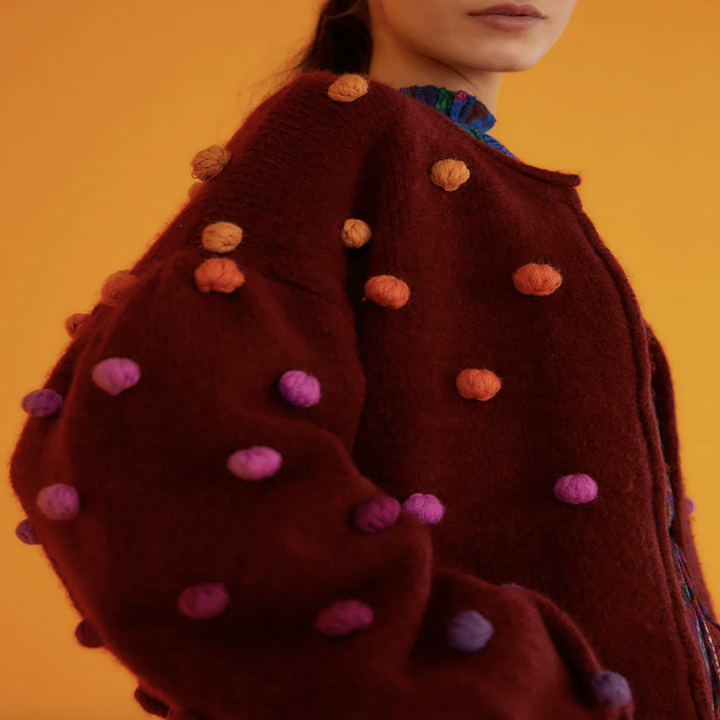 model wearing rainbow dots burgundy cardigan