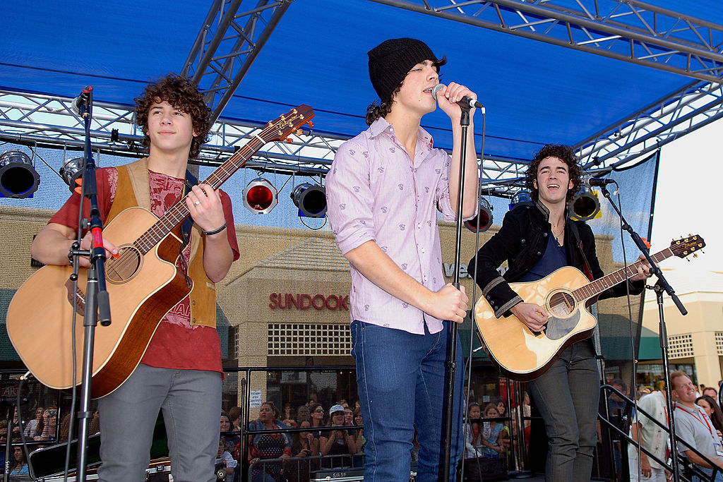 the brothers performing on stage