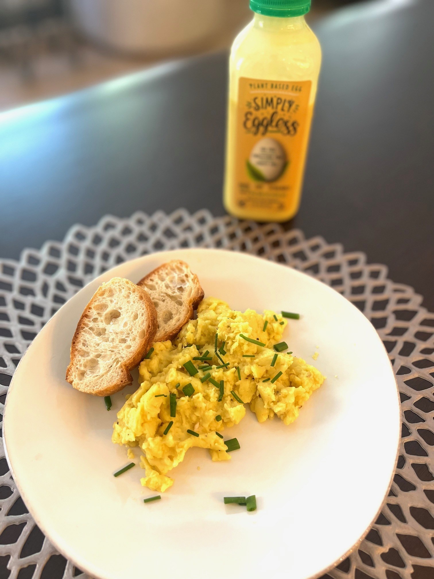 Plant-based topped with chives eggs on a plate.