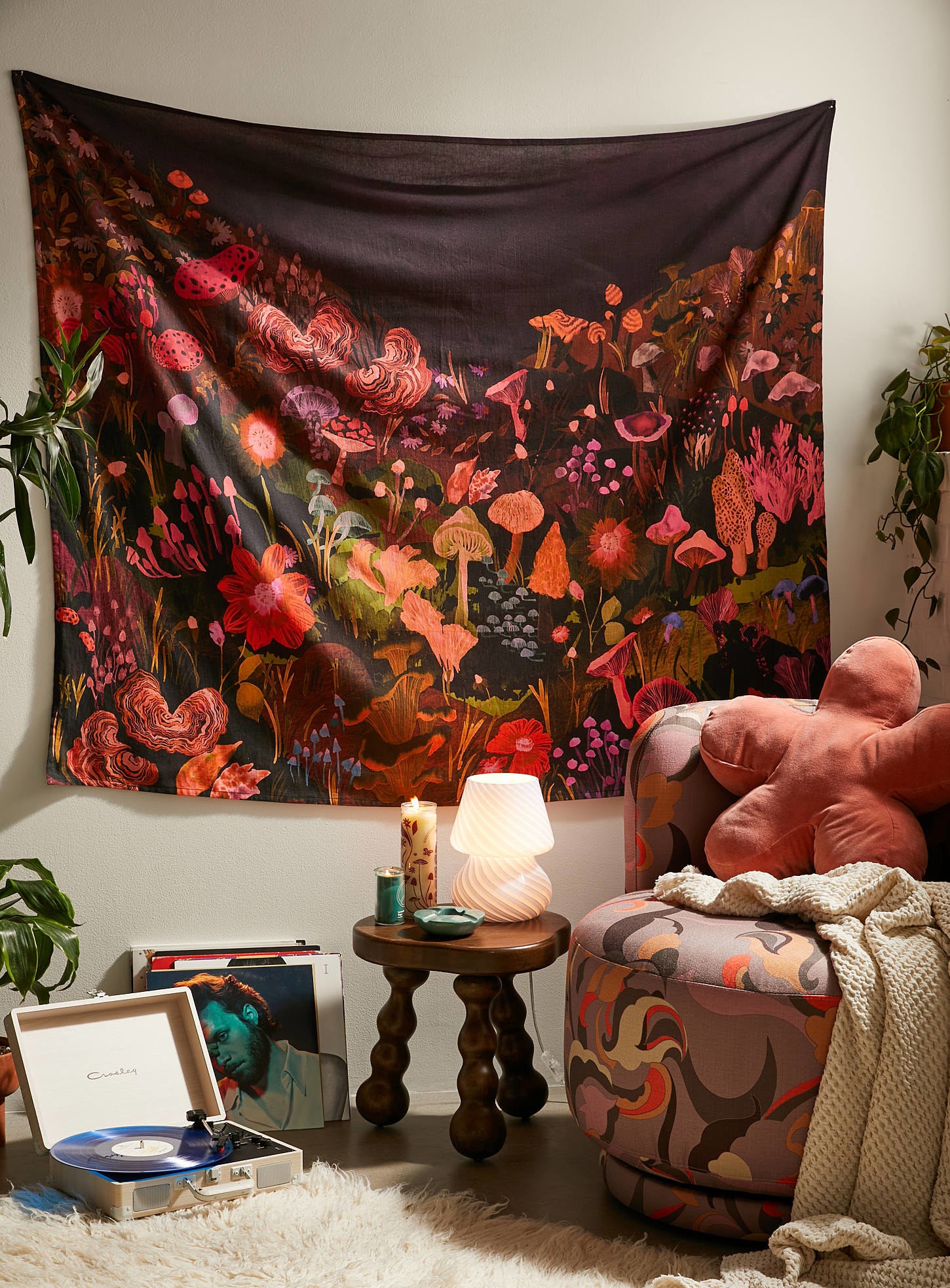 A mushroom tapestry on a wall in a stylish bedroom