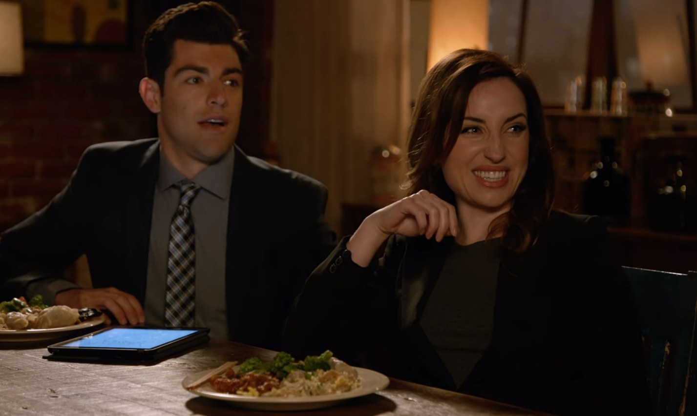 Schmidt and Fawn sit at the dinner table