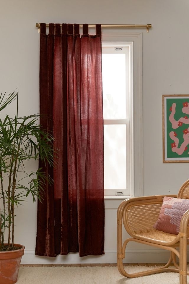 a velvet curtain hanging over a window