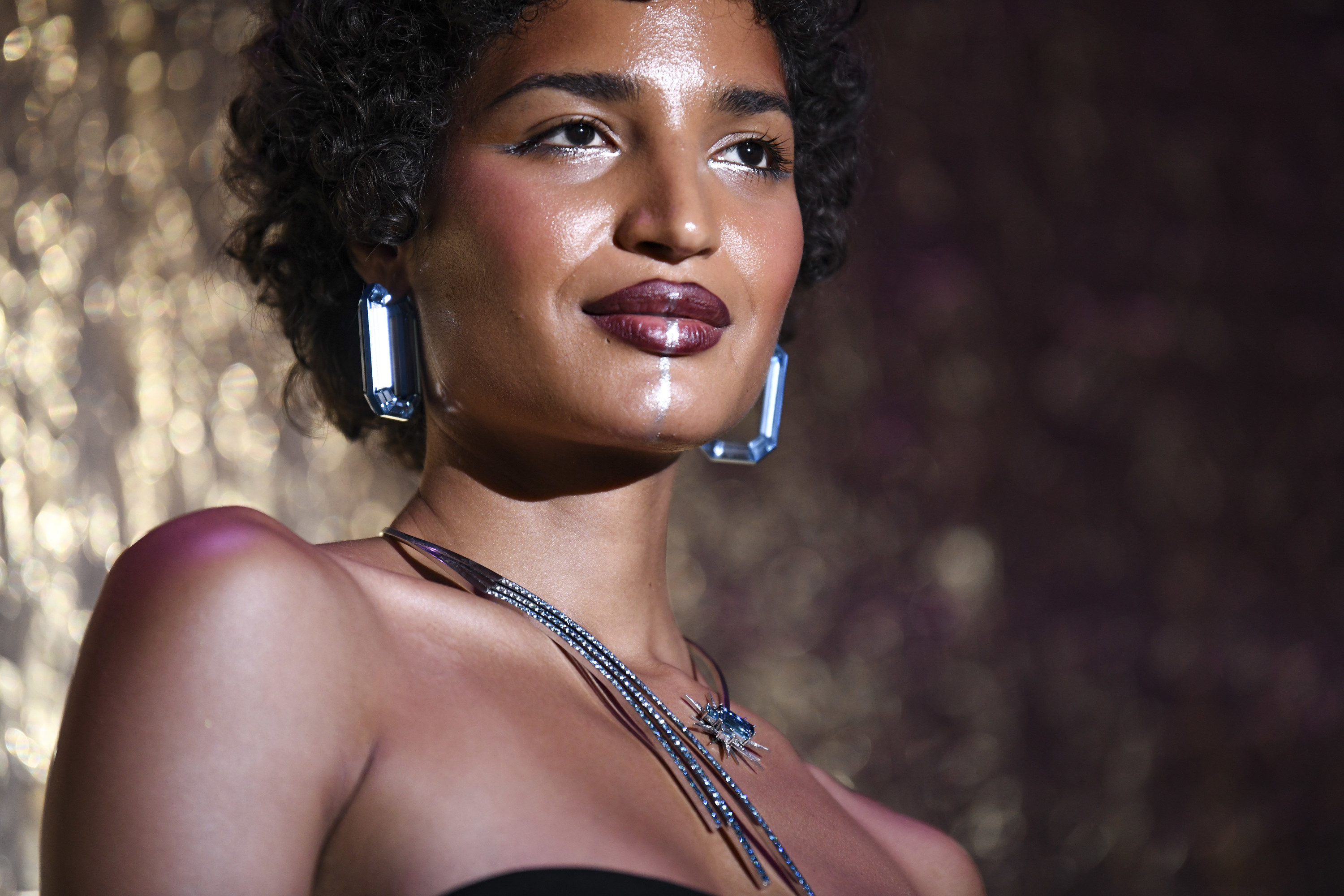 Indya Moore wears a FTX Diamond Necklace for auction during the amfAR Cannes Gala 2022