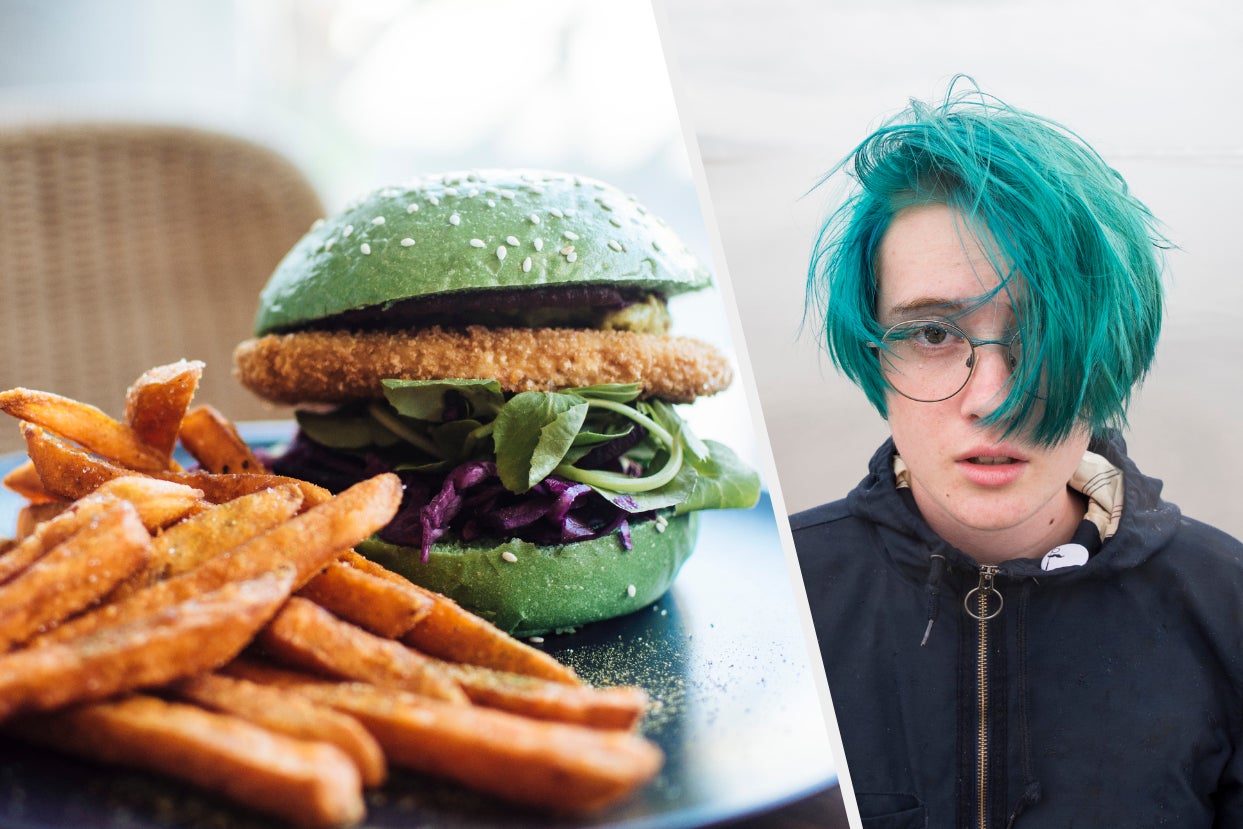 A veggie burger on a green bun and a kid with brightly colored hair