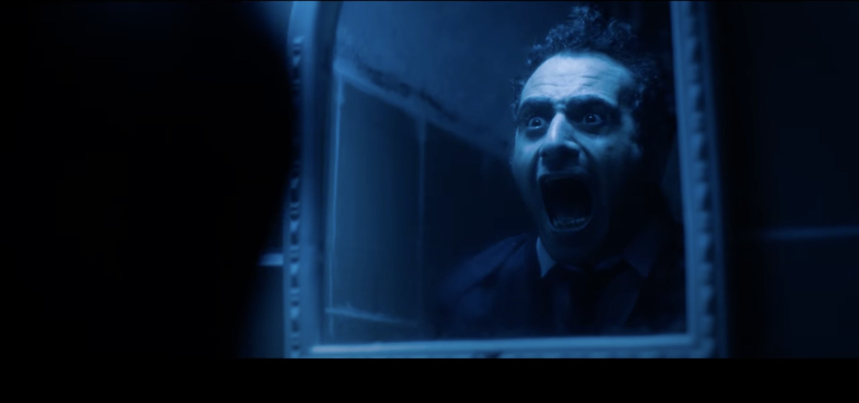 Man screaming in a mirror