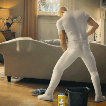 Mr. Clean washing the floor and dancing