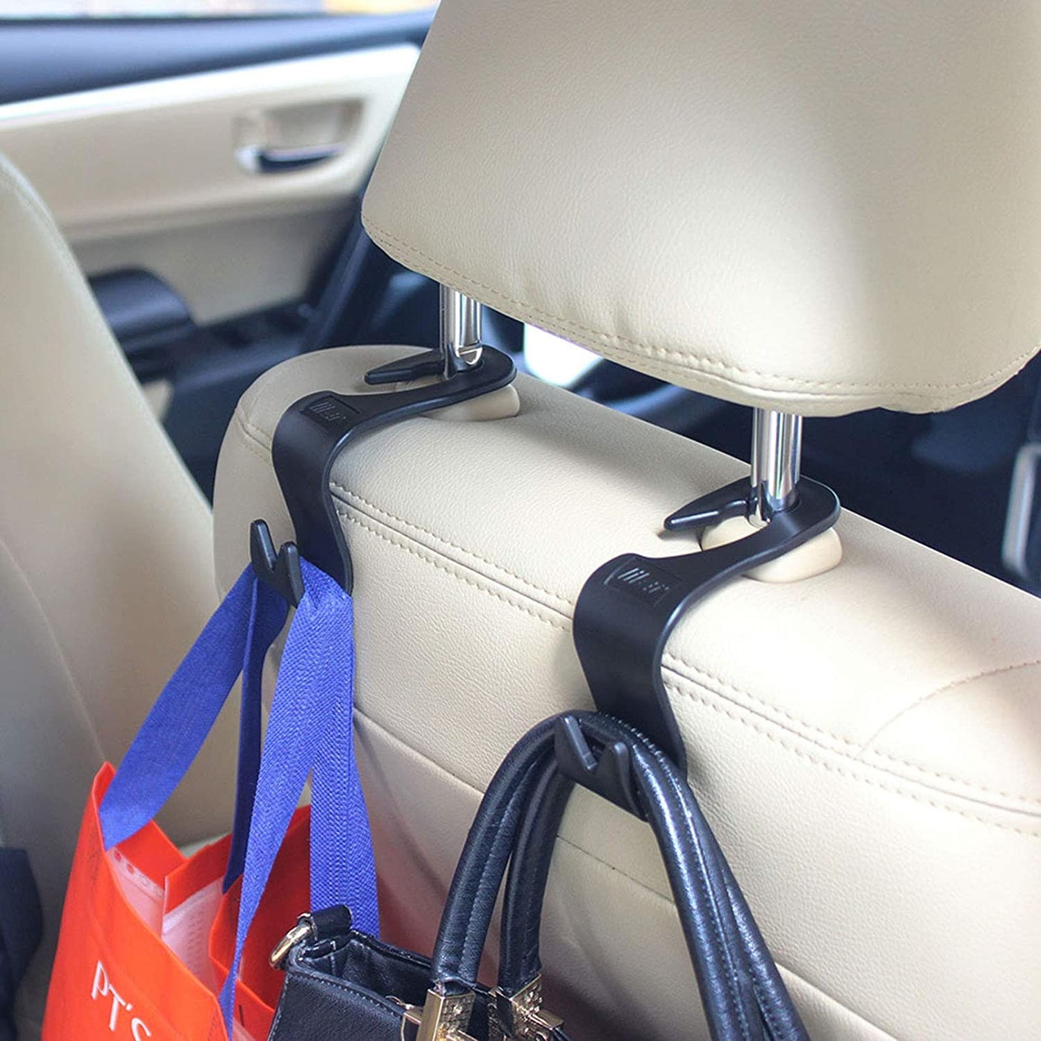 the hooks holding up bags while hanging from a headrest