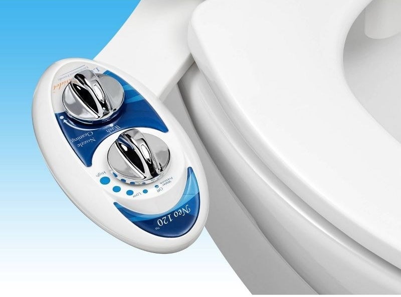 a blue and white bidet attachment connected to a toilet