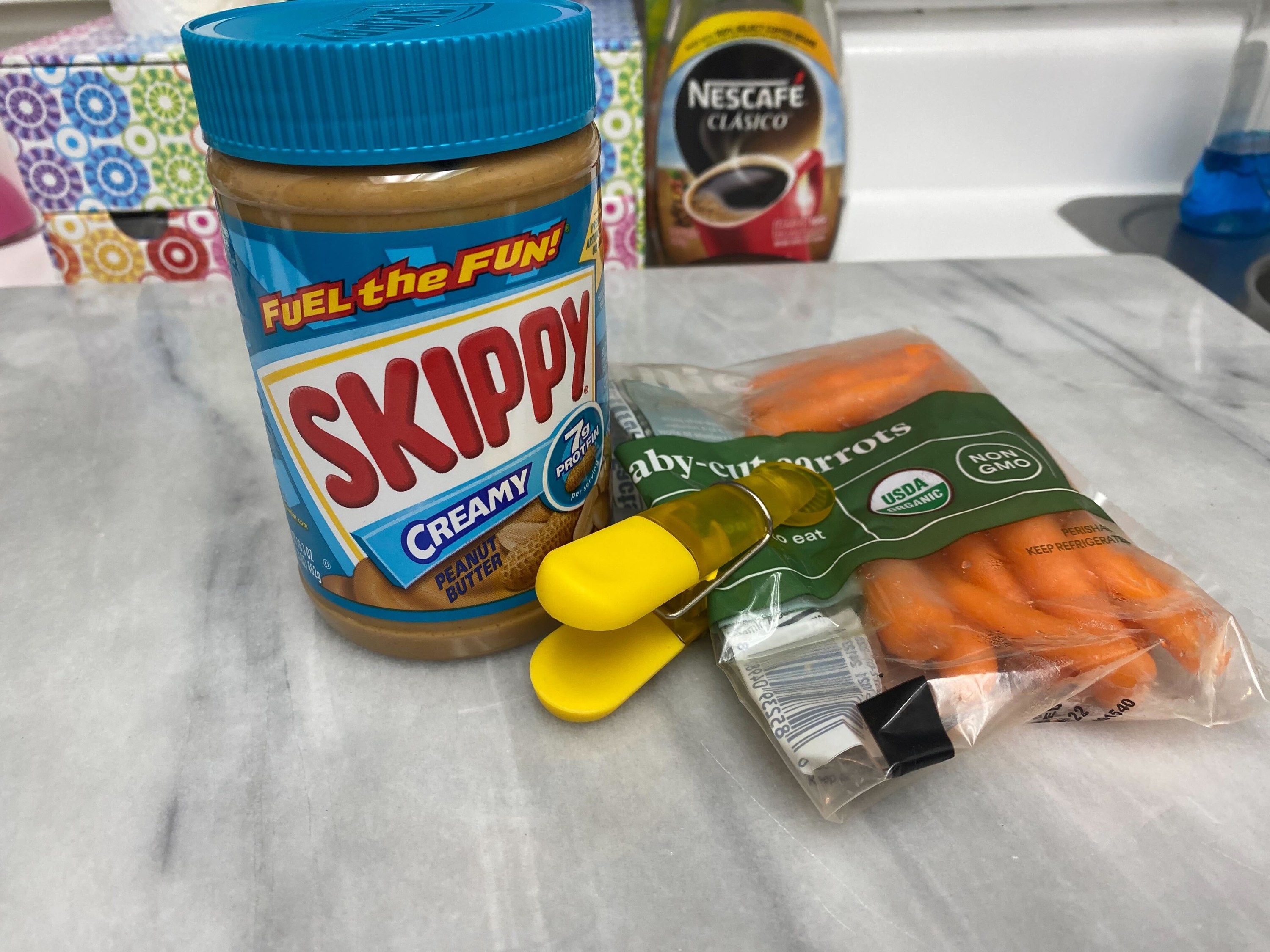 jar of peanut butter and bag of carrots