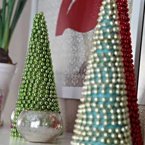 Cone-shaped trees with beads on them