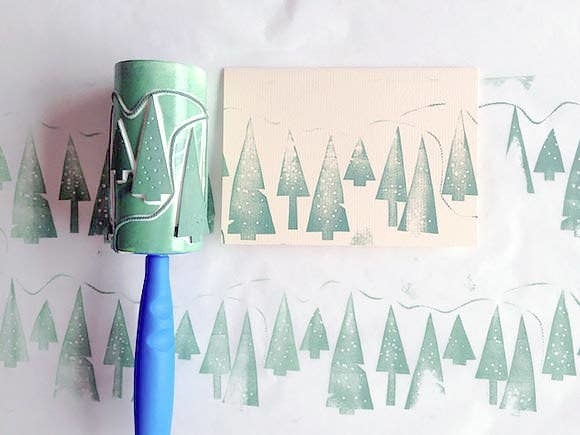 A lint roller with Christmas tree shapes on it
