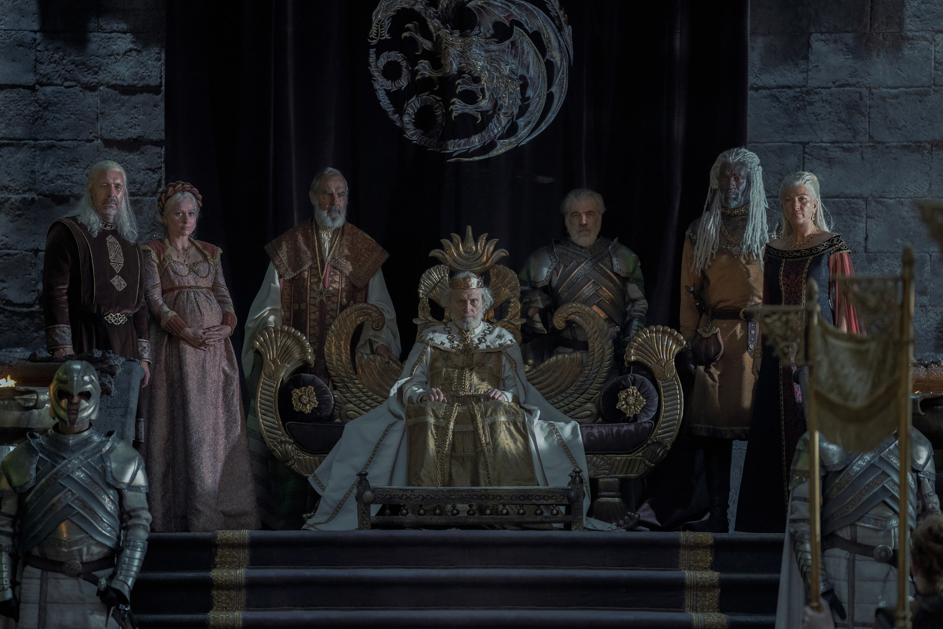 Jaeherys sits on a golden throne flanked by Viserys, Aemma, Corlys, and Rhaenys.