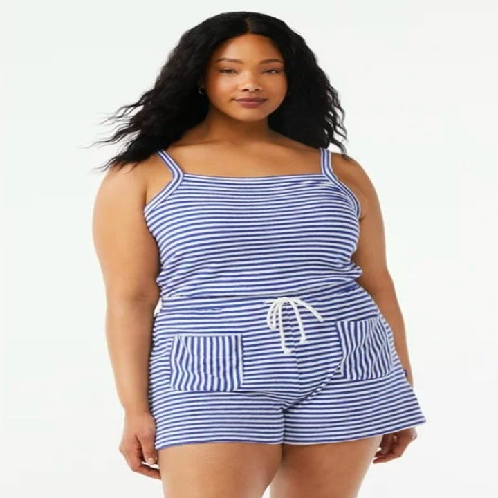 Model wearing striped blue and white romper