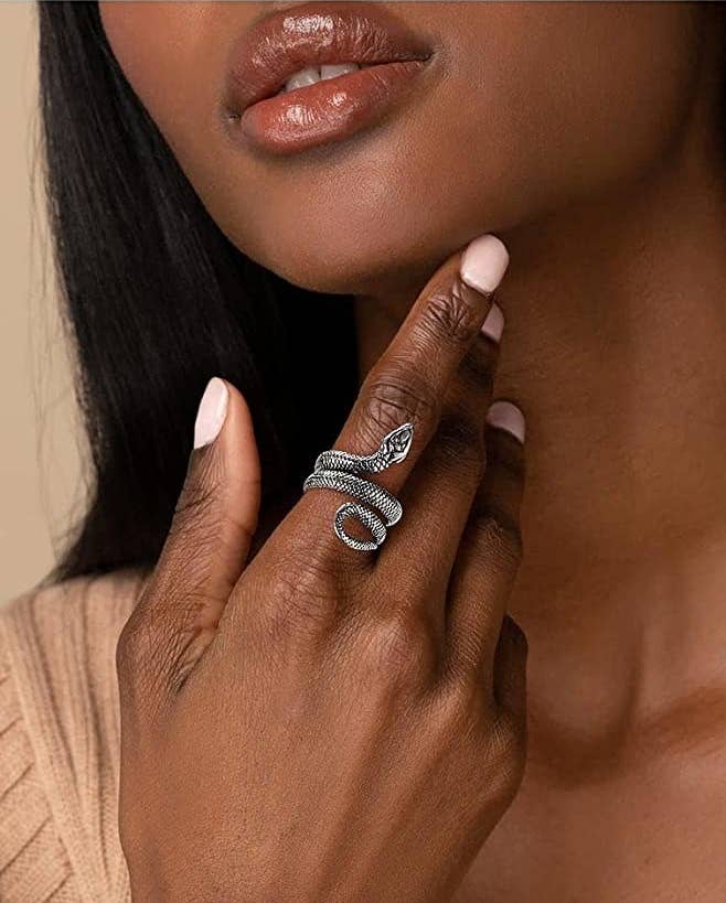a person wearing the snake ring on their index finger