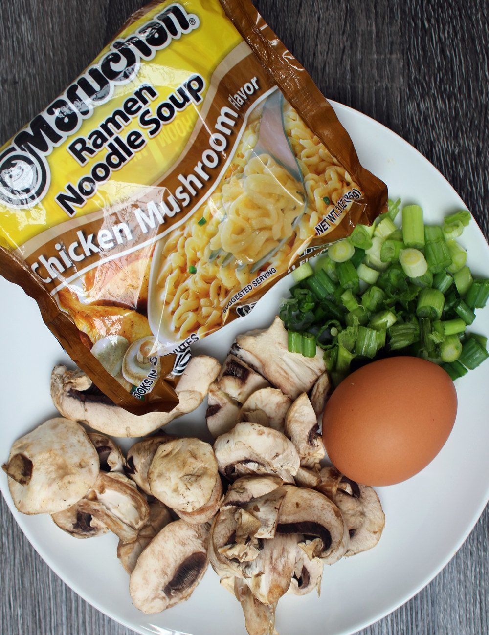 Mushrooms, an egg, and packaged instant ramen.