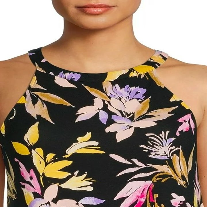close up of the halter neck dress in black with colorful flower print