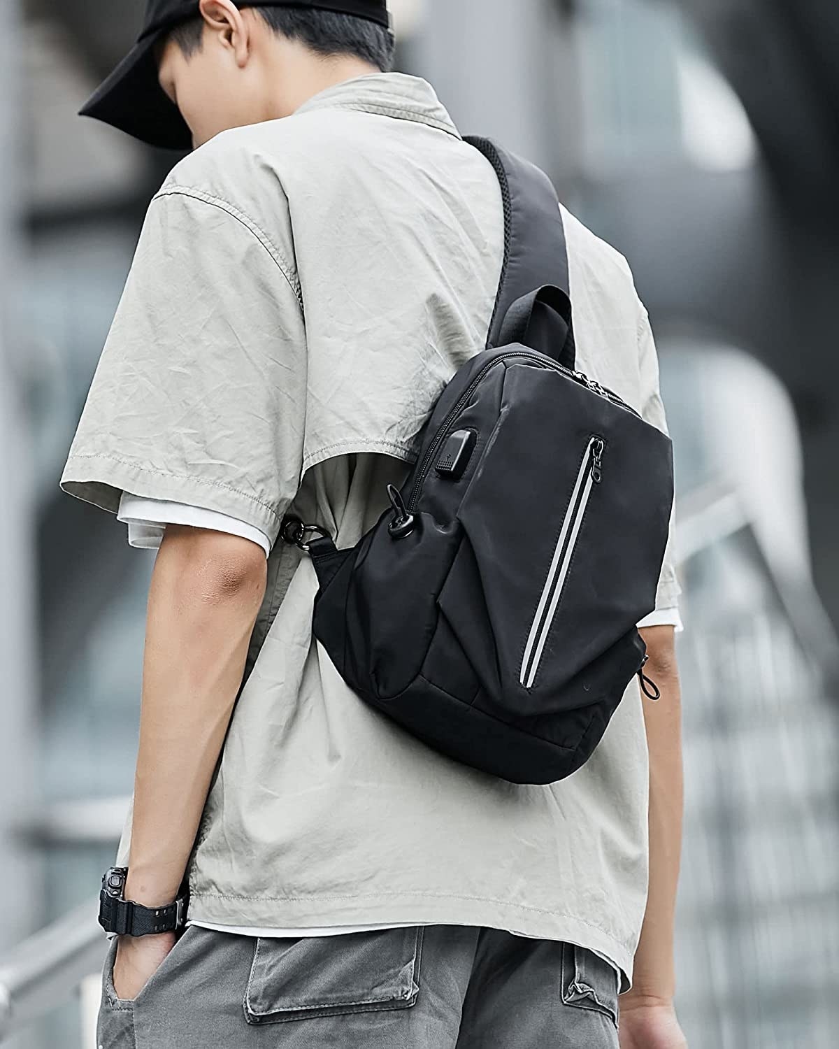 A person wearing the messenger bag on their back