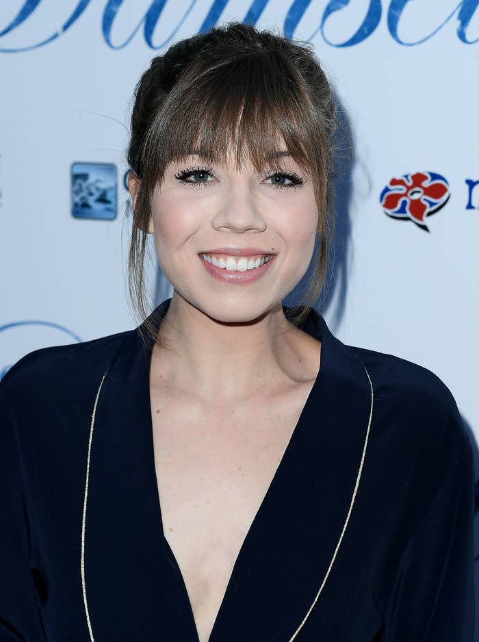 A closeup of Jennette smiling for a photo at an event