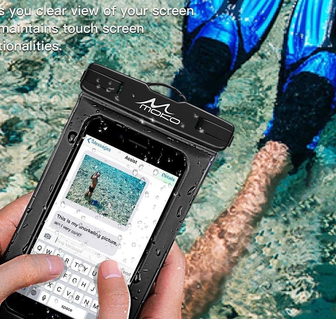 a person using their phone in the pouch while sitting in a body of water