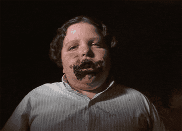 Bruce Bogtrotter, played by Jimmy Karz, eating chocolate cake