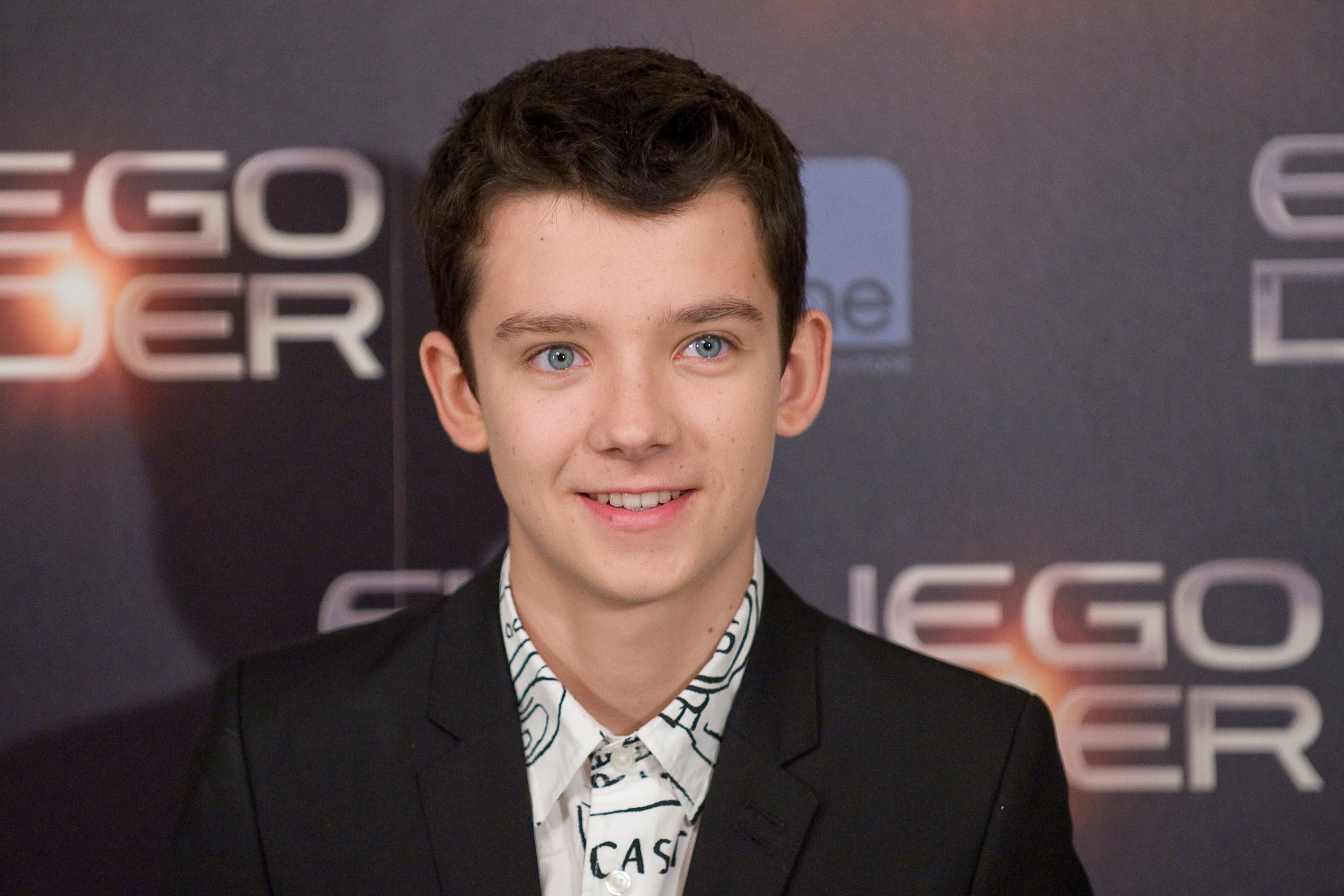Asa Butterfield smiling at a film event