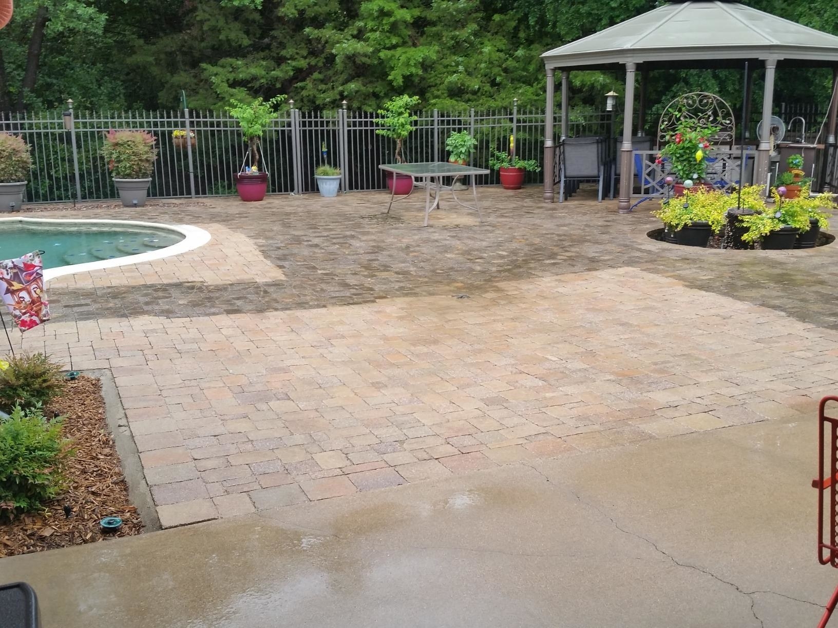 a reviewer photo of a pool deck mid-pressure washing