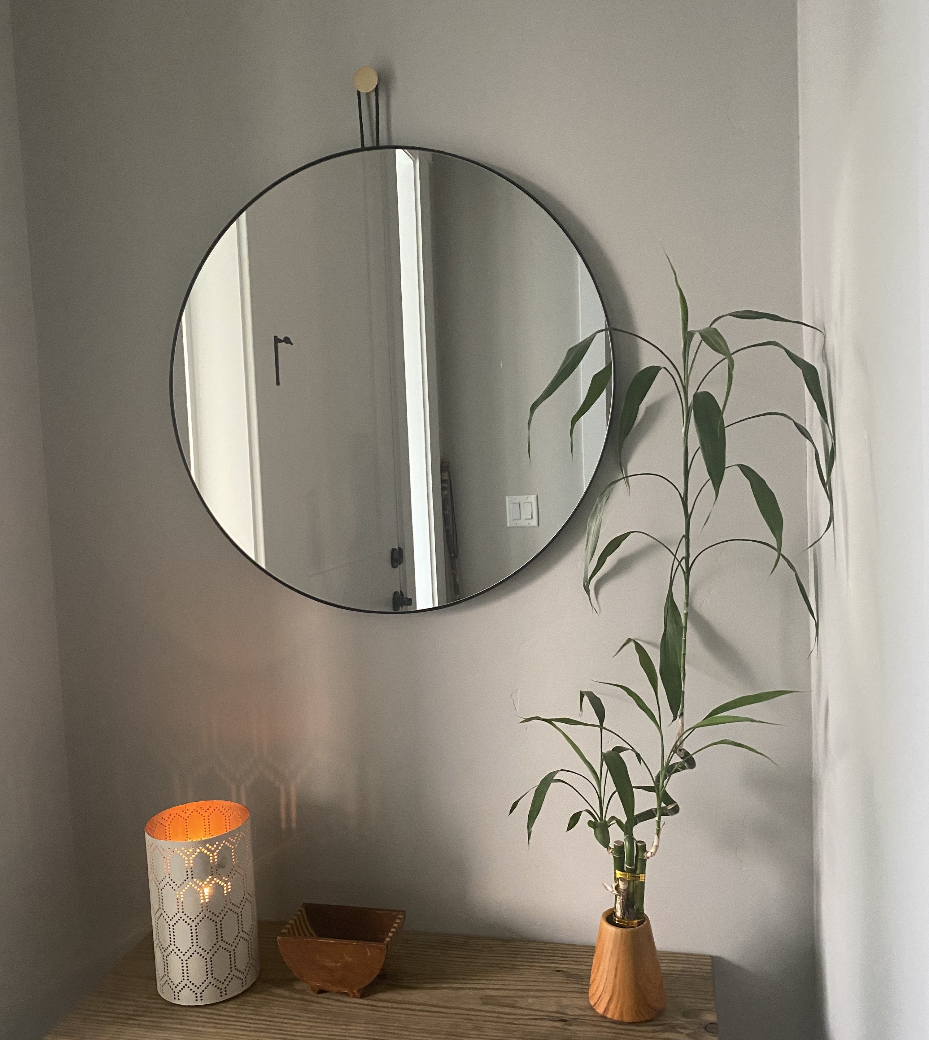 a reviewer photo of the mirror in an entryway