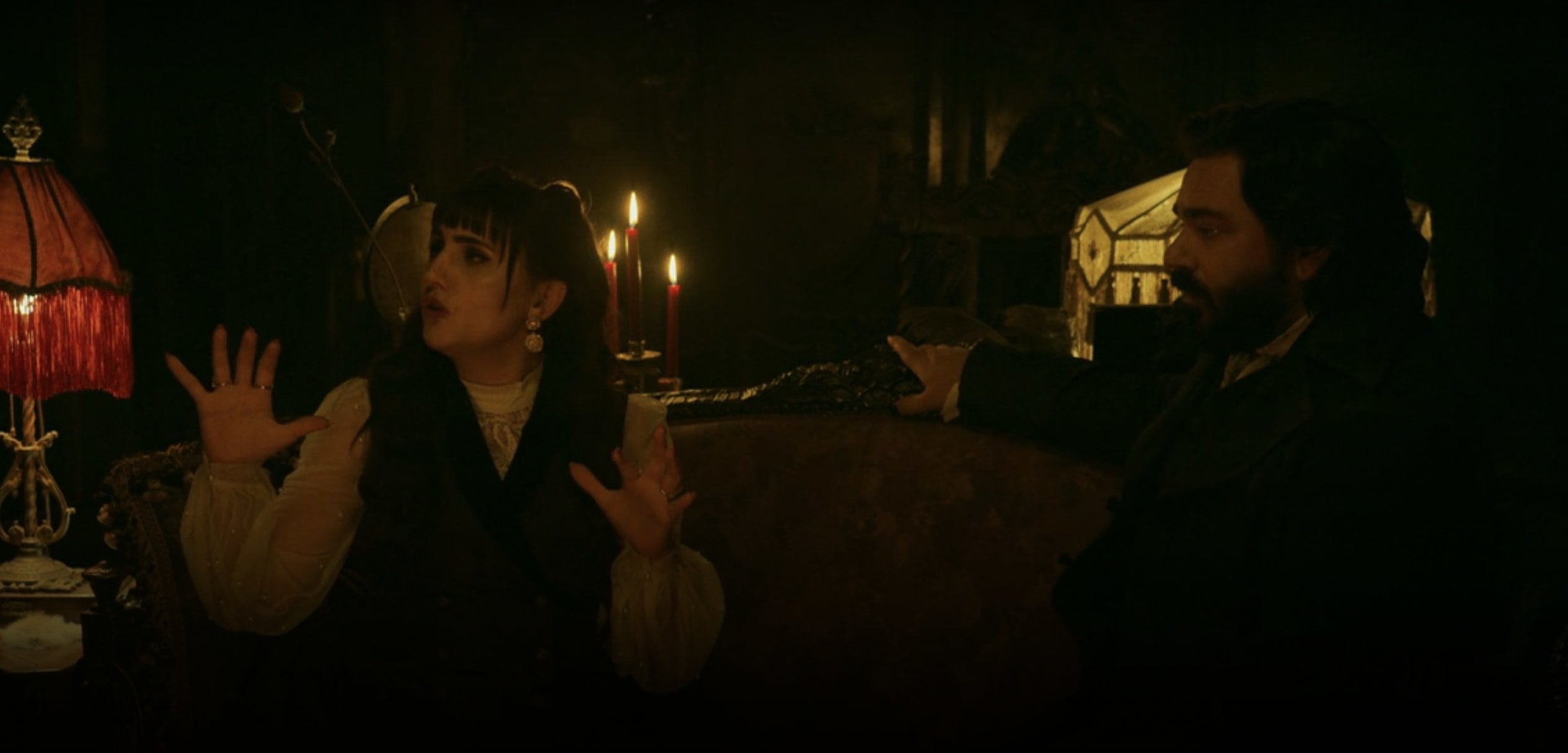 Nadja talking with Laszlo sitting next to her in &quot;What We Do In the Shadows&quot;