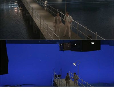 Nick and Gatsby walking on a pier which actually has a blue screen behind it