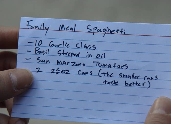 An index card with family meal spaghetti recipe