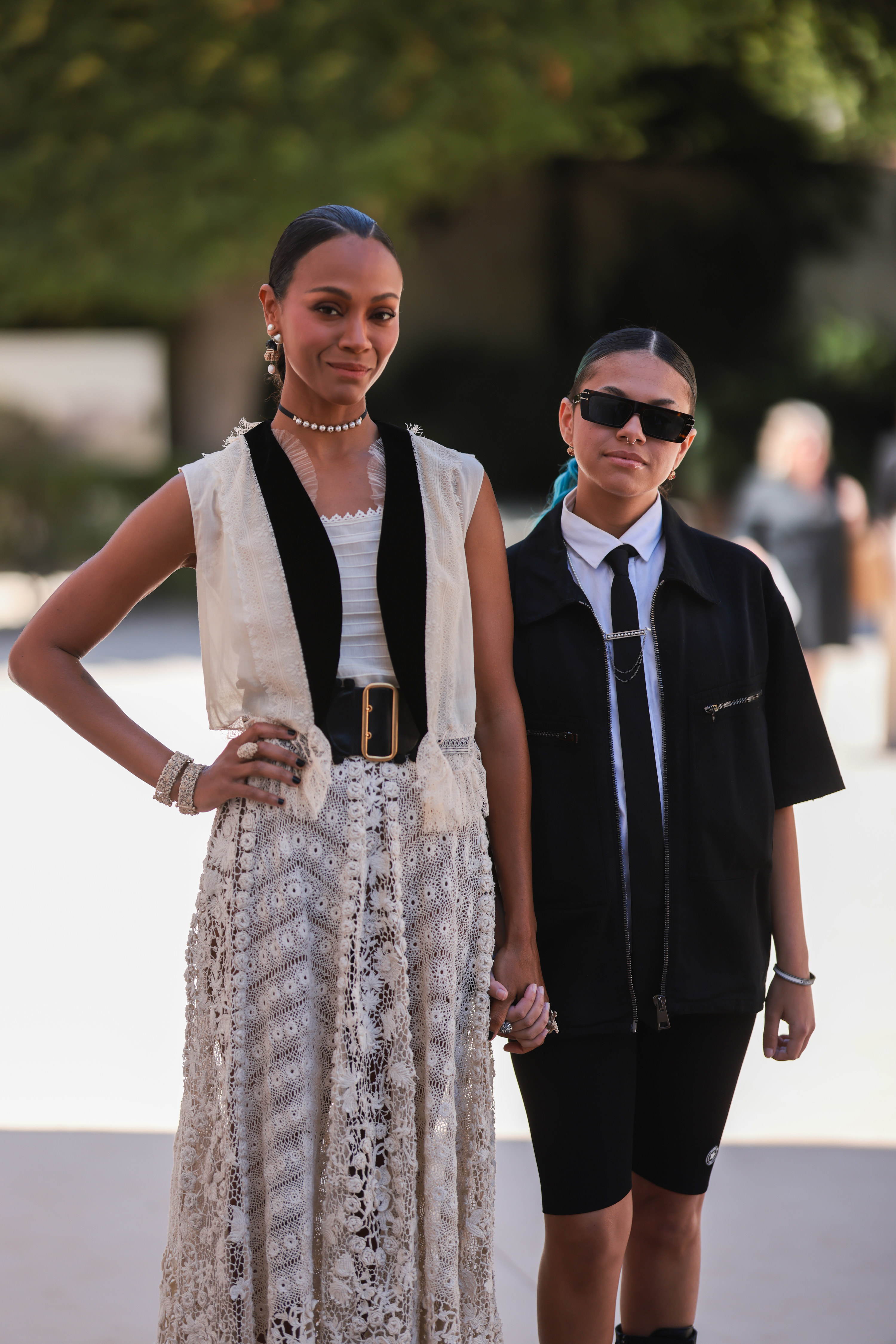 Zoe Saldana and her child wearing Dior during Paris Fashion Week 2022