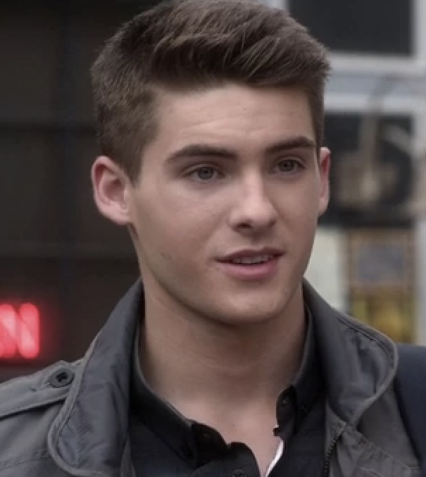 Cody Christian with brown hair and green eyes