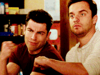 a gif of Nick and Schmidt from New Girl fist bumping