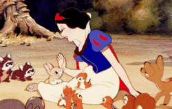 Snow White is surrounded by loving animals