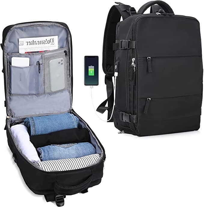 The backpack in black unzipped to show internal pockets and capacity