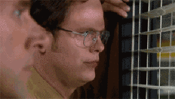 Gif of Dwight Schrute looking out the window in &quot;The Office&quot;
