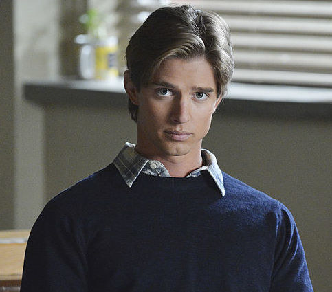 Drew Van Acker, who has blonde hair and gray eyes