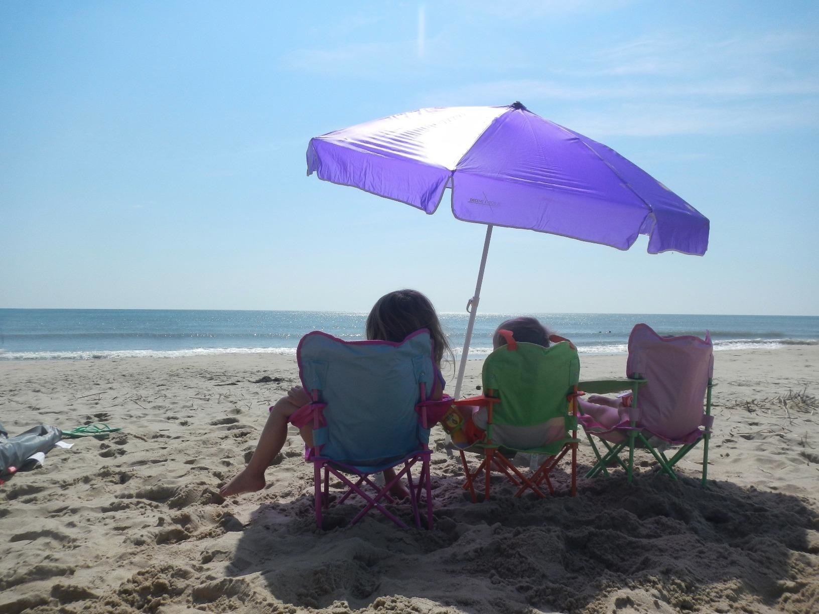 reviewer's children sitting successful  the chairs astatine  the beach