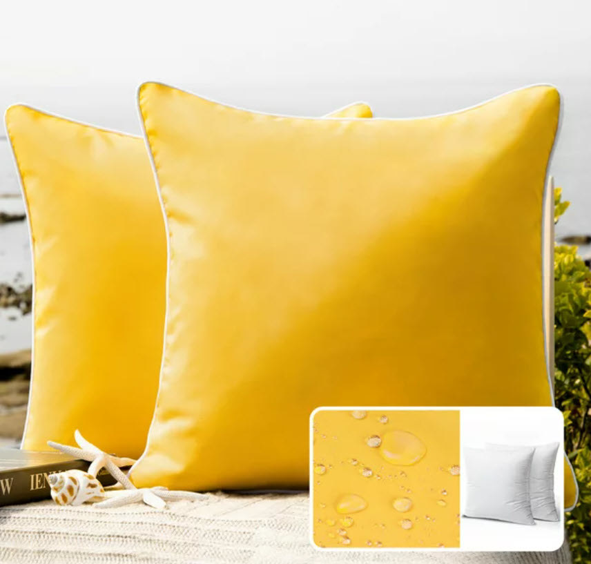two yellow waterproof outdoor pillows