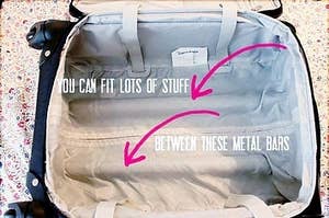 A photo of the space between the metal bars in a rolling suitcase