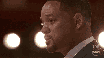 Will Smith crying on stage during The 2022 Academy Awards