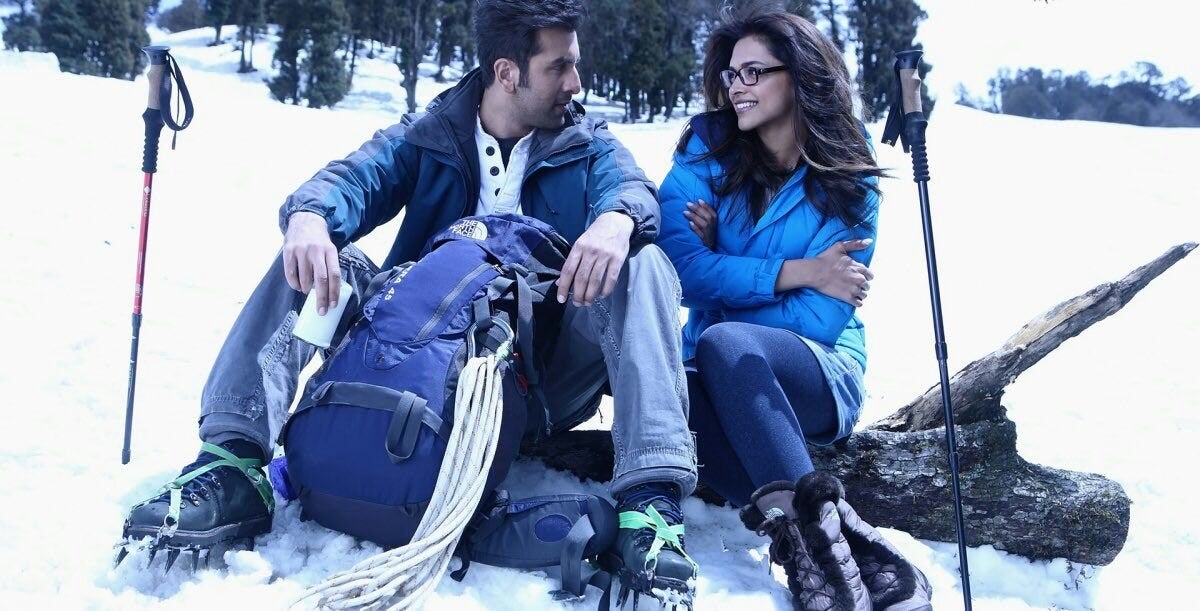 Ranbir and Deepika sit on rocks in the snow and converse