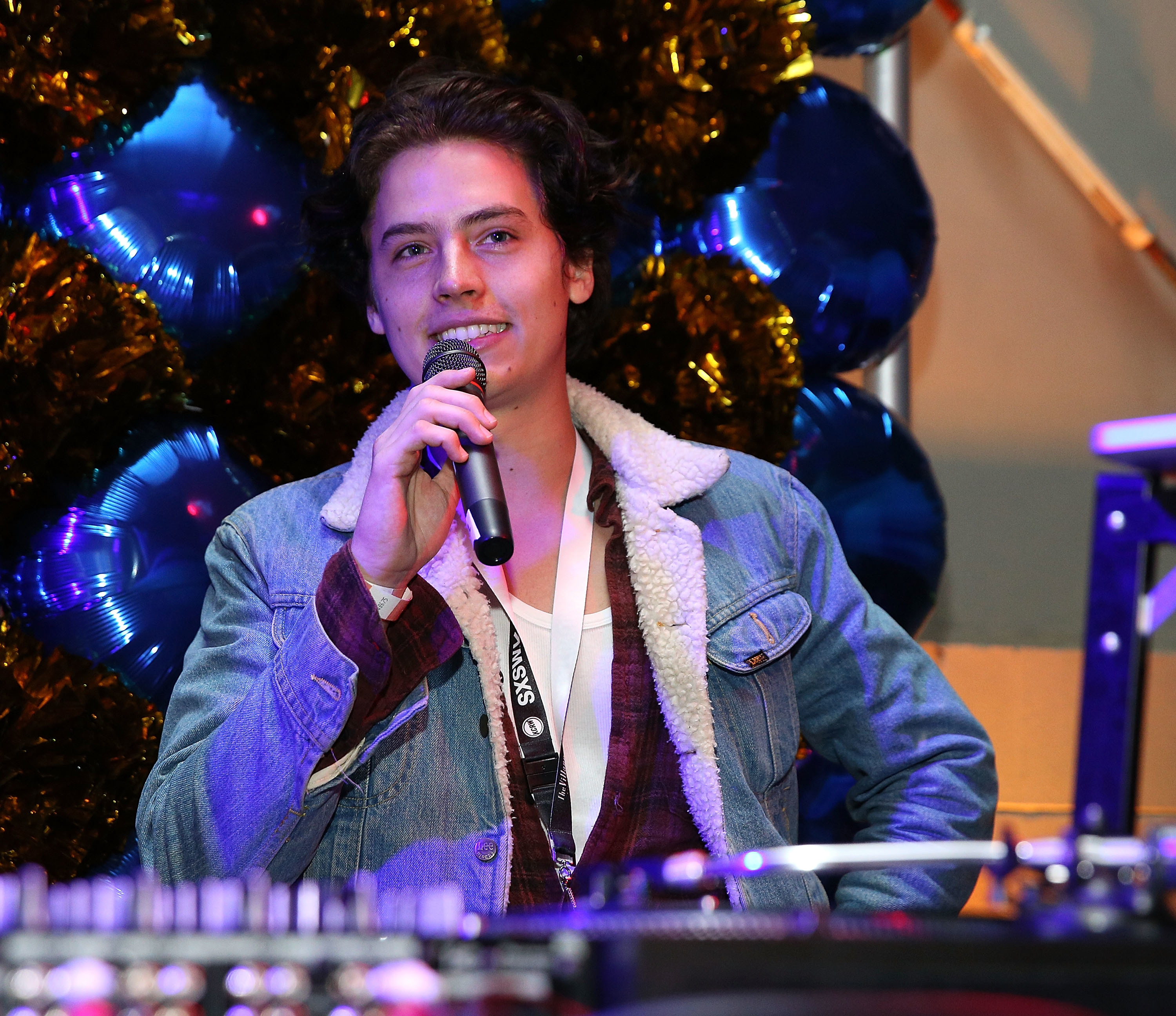 Cole Sprouse speaking at an event