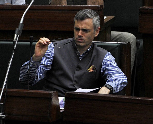 Omar Abdullah makes a gesture in the parliament