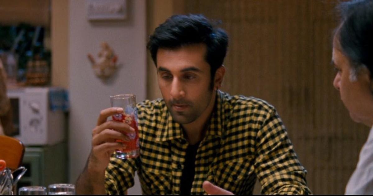 Ranbir stares at a glass of rooh afza while holding it